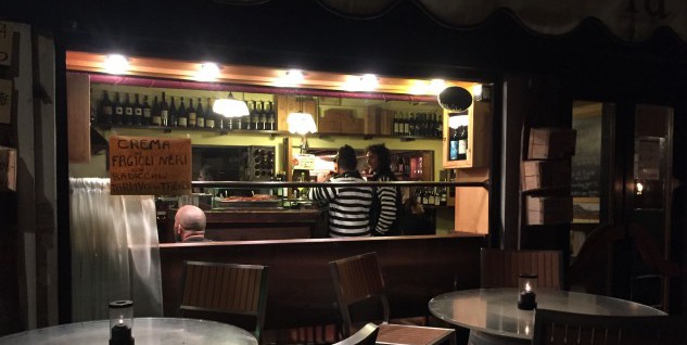 Gondoliers at the bar at La Cantina, enjoying the produce.