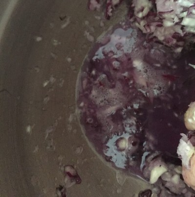 After massaging the cabbage for five minutes, the liquid level is starting to build up.