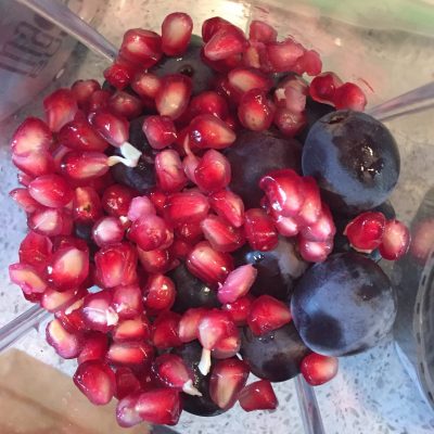 Cleaned grapes and pomegranate seeds ready for blending