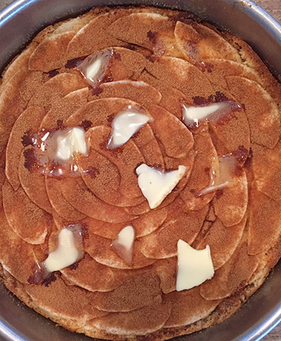 Half way through he bake, sprinkle the top with sugar and cinnamon, and put some dots of butter on. 