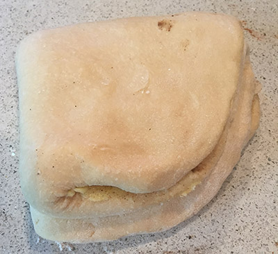 Folded into four before being rolled out again. 