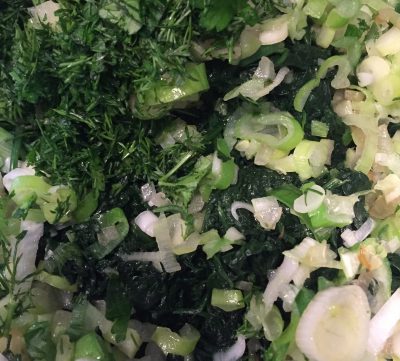 Herbs and spring onions ready to mix.