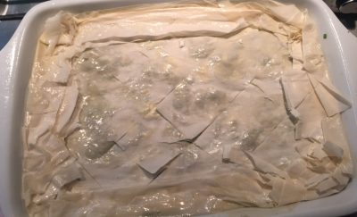 Edges trimmed and folded, the top brushed with little butter, and ready for the oven.